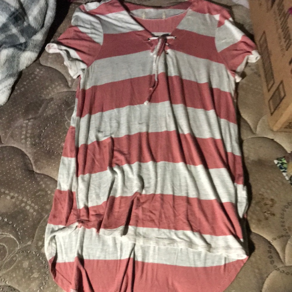 It’s white and pink stripes with a tie up v neck